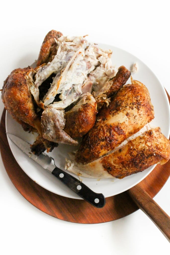 broken down cooked chicken on a plate