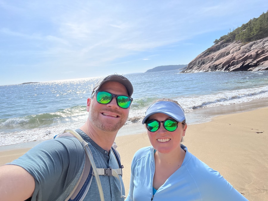 anne and matt mauney on sand beach in acadia national park