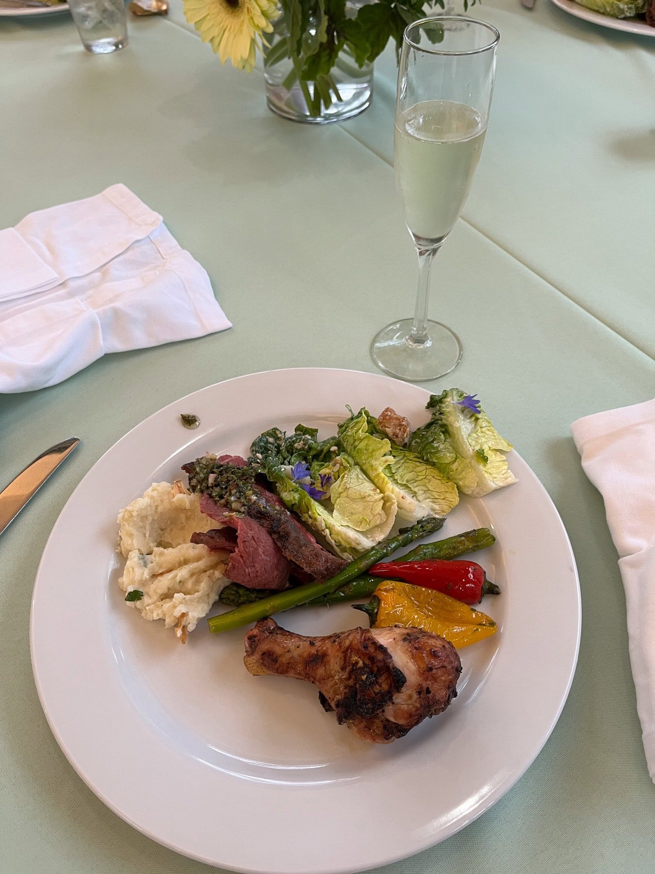 steak and chicken with veggies and potatoes