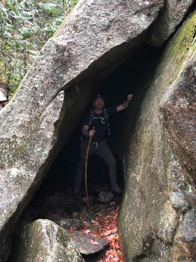 hiking through a cave on the giant slide