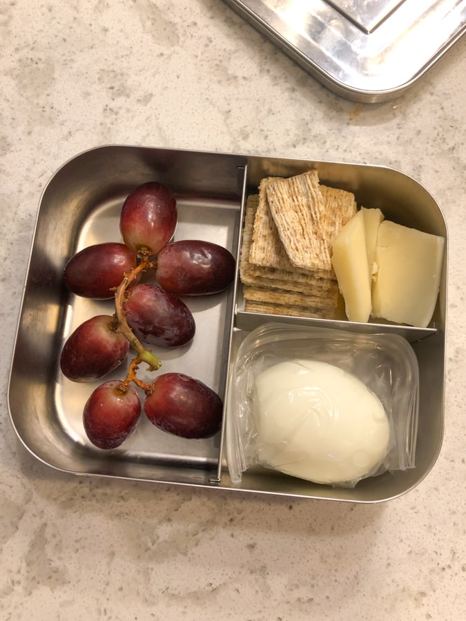 grapes, hard boiled egg, crackers and cheese