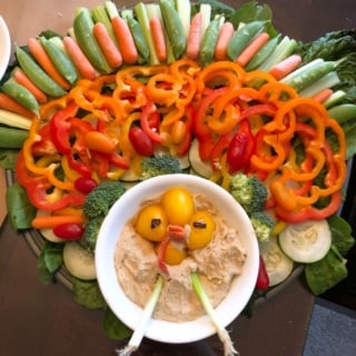 vegetables and hummus in the shape of a turkey