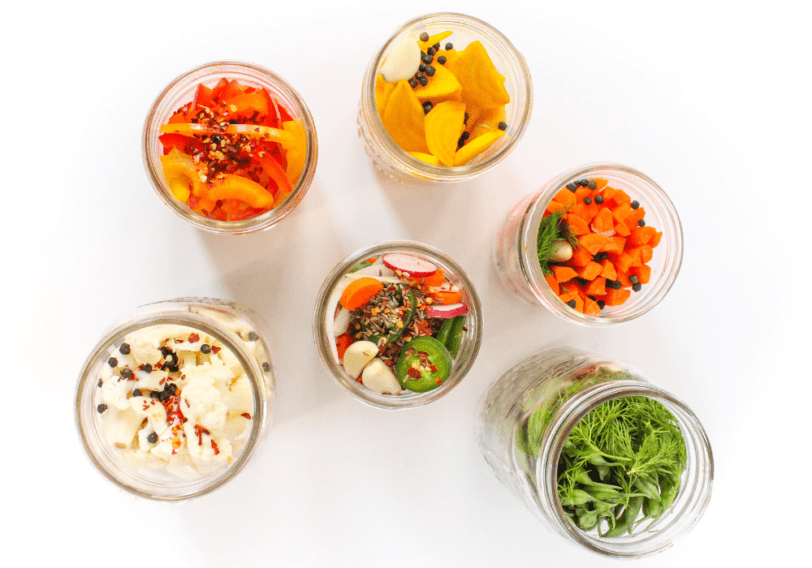 flatlay of fermented vegetables in mason jars