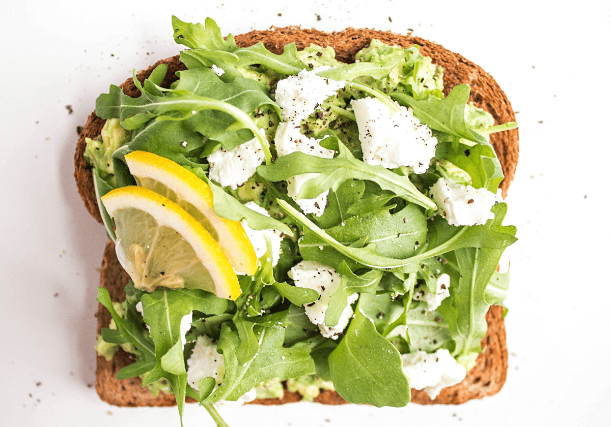 goat cheese smashed avocado toast with arugula