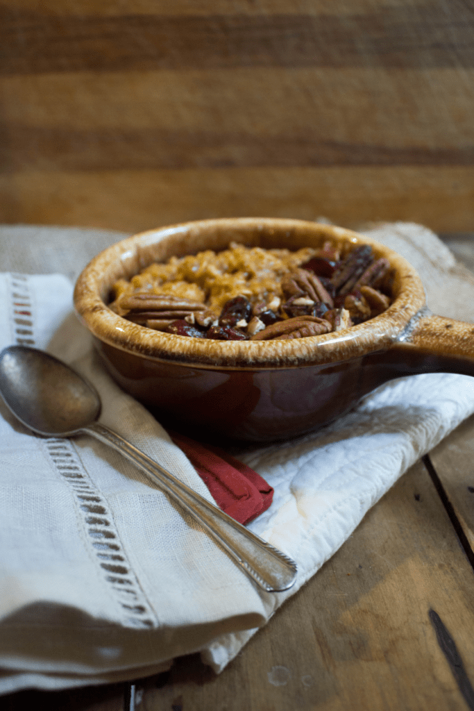 pumpkin pie oatmeal in a ramekin with a handle