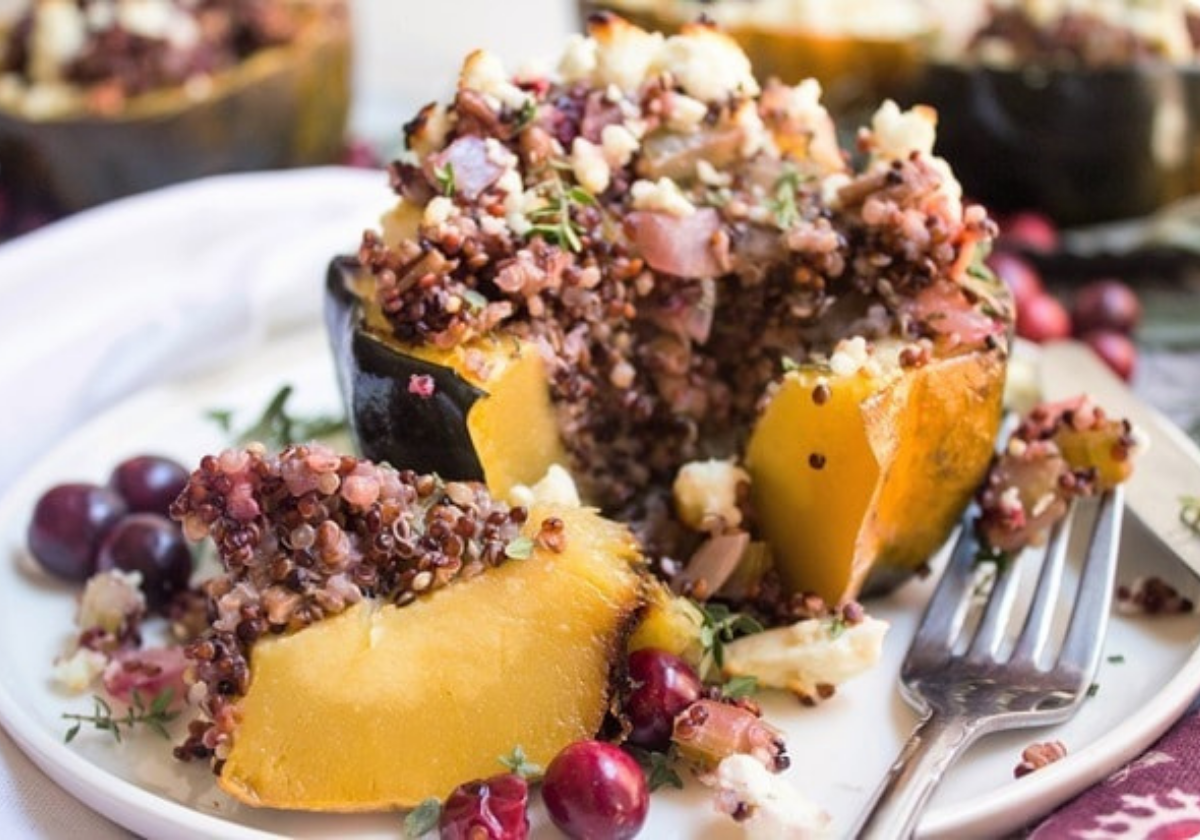 stuffed acorn squash cut in half on a plate